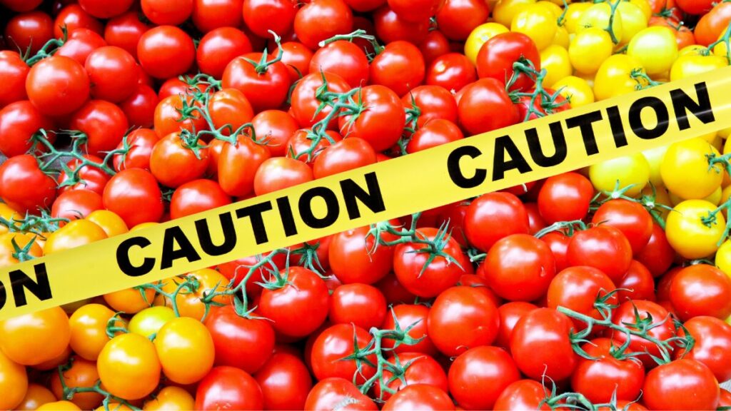 Photo of a variety of cherry tomatoes with "CAUTION" tape over the photo.